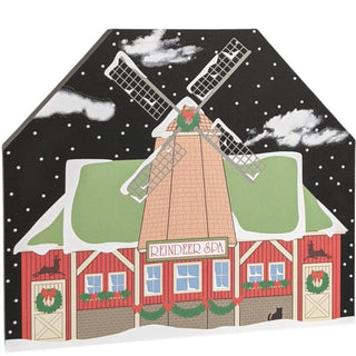 3/4" thick wooden replica with an illustration of a windmill with 'Reindeer Spa' text against a snowy background