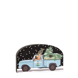 3/4" thick wooden replica with an illustration of a  truck and reindeer carrying Christmas trees on a white background