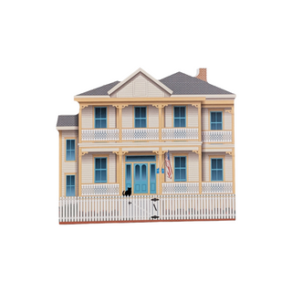 3/4" wooden replica with an illustration of a two-story house with a white picket fence on a white background