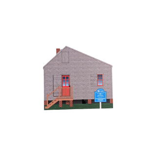 3/4" wooden replica with an illustration of Small house with a blue sign in front on a white background