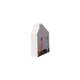 3/4" wooden replica with an illustration of a small wooden house with blue sign and read door and window