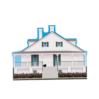 3/4" wooden replica with an illustration of a white house with porch, flowers and green shutters 