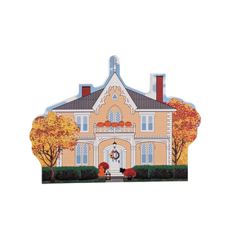 3/4" wooden replica with an illustration of a house with Halloween decorations on a white background