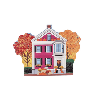 3/4" wooden replica with an illustration of a house with autumn trees and pumpkins on a white background