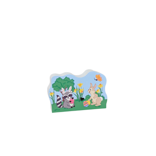 3/4" thick wooden replica with an illustration of a Easter scene with a raccoon, rabbit, and butterfly on a white background