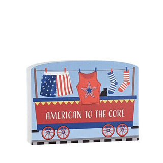 3/4" Wooden replica with a train and American-themed clothing on a white background