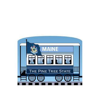 3/4" Wooden replica with an illustration of a Blue train car with Maine state flag and text on a white background