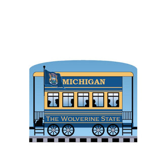 3/4" Wooden replica with a Illustration of a blue train car with 'Michigan' and 'The Wolverine State' text on a white background