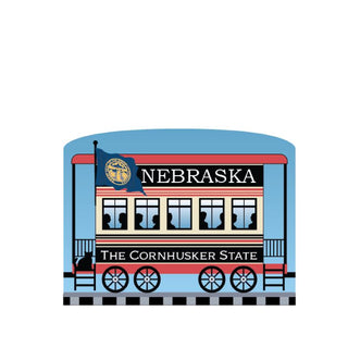 3/4" Wooden replica with a Illustration of a train car with 'Nebraska' and 'The Cornhusker State' text on a white background