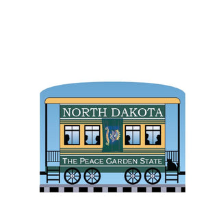 3/4" Wooden replica with a Illustration of a train car with 'North Dakota' and 'The Peace Garden State' text on a white background