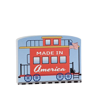 3/4" Wooden replica with a illustration of a train design and 'Made in America' text on a white background