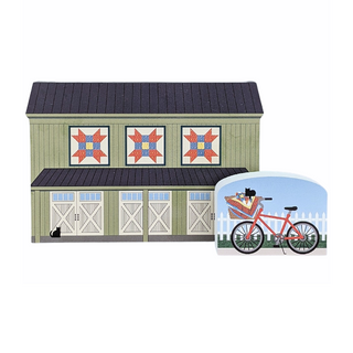 3/4" thick wooden illustrations of a barn with quilt blocks and a bicycle with a quilt