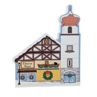3/4" thick wooden  Decorative model of a cheese haus with festive decorations on a white background
