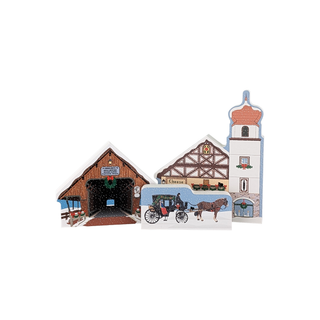 3/4" thick wooden illustrations of a Christmas winter village on a white background