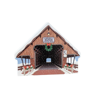 3/4" thick wooden replica of a covered bridge design featuring a wreath and festive decorations.