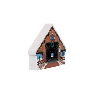 3/4" thick wooden replica of a covered bridge design featuring a wreath and festive decorations.