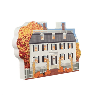 3/4" thick wooden Decorative of Ropes Mansion with autumn leaves and pumpkins on a white background