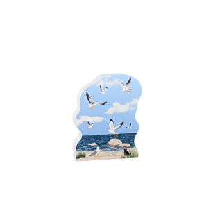 Decorative wooden replica with a beach scene featuring seagulls.