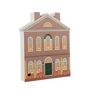 wooden replica with an illustration of a Brick building with 'Town Hall' sign and pumpkins on a white background