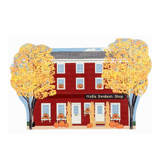 3/4" thick wooden model with 'Red's Sandwich Shop' sign, surrounded by trees with yellow leaves and pumpkins.