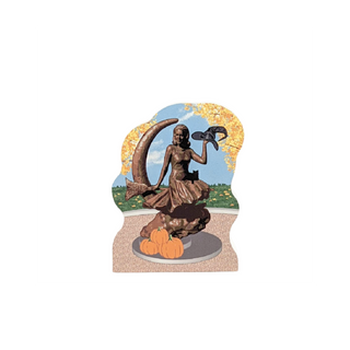 3/4" thick wooden Decorative cutout of a woman with a witch hat surrounded by pumpkins and autumn leaves on a white background.