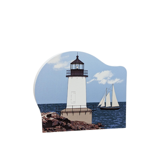 3/4" thick wooden replica with an Illustration of a lighthouse design with a sailboat on a white background