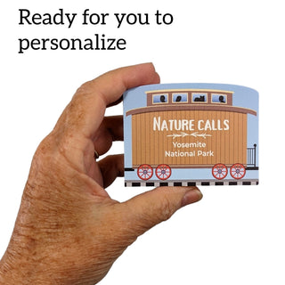 3/4" Wooden replica with a Yosemite National Park design held by a hand, text 'Ready for you to personalize' above.