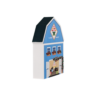 3/4" thick wooden illustration of a blue barn with decorative elements on a white background