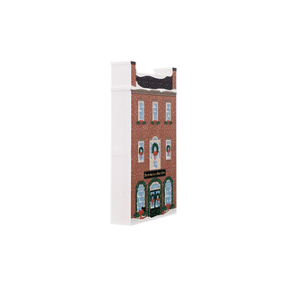 3/4" thick wooden Christmas-themed building with wreaths and red bows on a white background