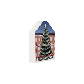 3/4" thick wooden replica with a Christmas tree in front of a brick building and street lamps.