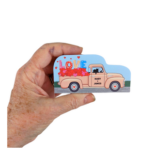 Hand holding a 3/4" thick wooden cutout of a vintage truck and 'LOVE' text design.