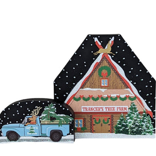3/4" thick wooden replica with an illustration of a  barn labeled 'Trancer's Tree Farm' and a truck carrying Christmas trees, all set against a snowy background.