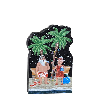 3/4" thick wooden replica with an illustration of a  couple on a tropical beach with palm trees and a dark sky.
