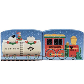 3/4" thick wooden replica with an illustration of a  Christmas-themed train set on a book page with a blue background.