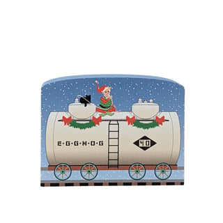 3/4" thick wooden replica with an illustration of a Christmas train car with an elf and dog on a blue snowy background