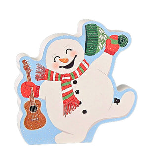3/4" thick wooden replica with an Illustration of a snowman with a light blue outline, featuring a smiling snowman wearing a red-and-green striped scarf and hat, holding a brown guitar and red mittens, on a plain white background.