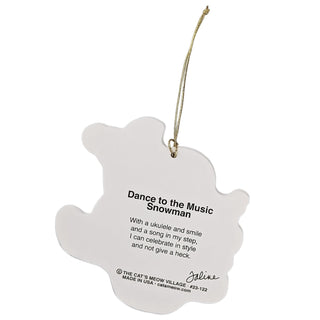 A white hanging ornament with a gold string, featuring the text 'Dance to the Music Showman' and a short poem from The Cat's Meow Village, on a plain white background.