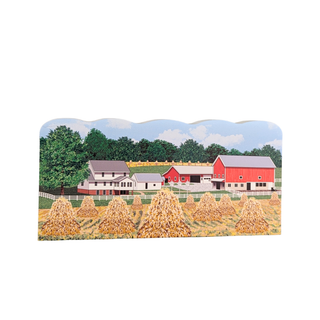 3/4" wooden cut out replica of an Illustration of a farm scene with barns and haystacks on a white background