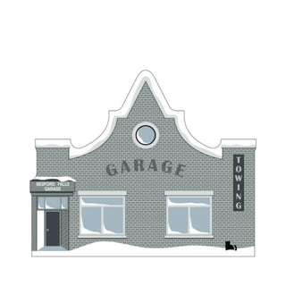 3/4" thick wooden replica with an illustration of a  garage building with snow on the roof
