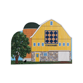 3/4" thick wooden illustration of a colorful barn with quilt design and 'Crossroads' text on a white background