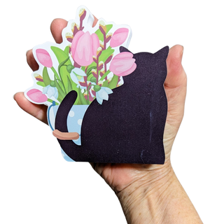 Black cat-shaped 3/4" thick wooden cutout  with a bouquet of flowers on a white background