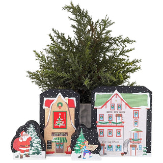 Decorative house-shaped planters with a small Christmas tree inside on a white background