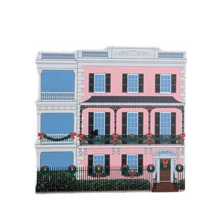 3/4" thick wooden illustration of a pink house with holiday decor