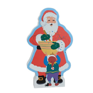 3/4" thick wooden replica with an Illustration of a Santa Claus in a red suit holding a basket of green ornaments, with a small elf standing in front, on a plain white background.
