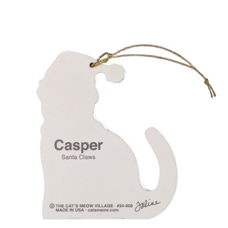 A white cat silhouette hanging ornament with a gold string, printed with the name 'Casper' and 'Santa Claws' on a white background.