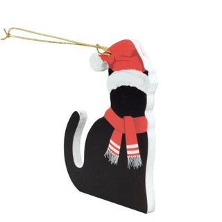 Black cat-shaped ornament with a Santa hat and scarf on a white background