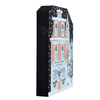 3/4" thick wooden replica with an illustration of a  snowy village design on a white background