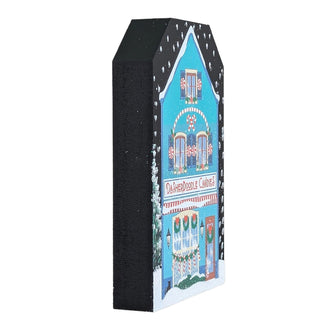 3/4" thick wooden replica with an illustration of a  festive building design on a white background