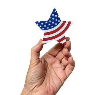 hand holding 3/4" thick wooden american flag cut into a star shape