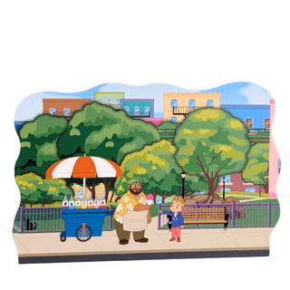 3/4" thick wooden Cartoon scene of a man and child in a park with a food cart and trees.